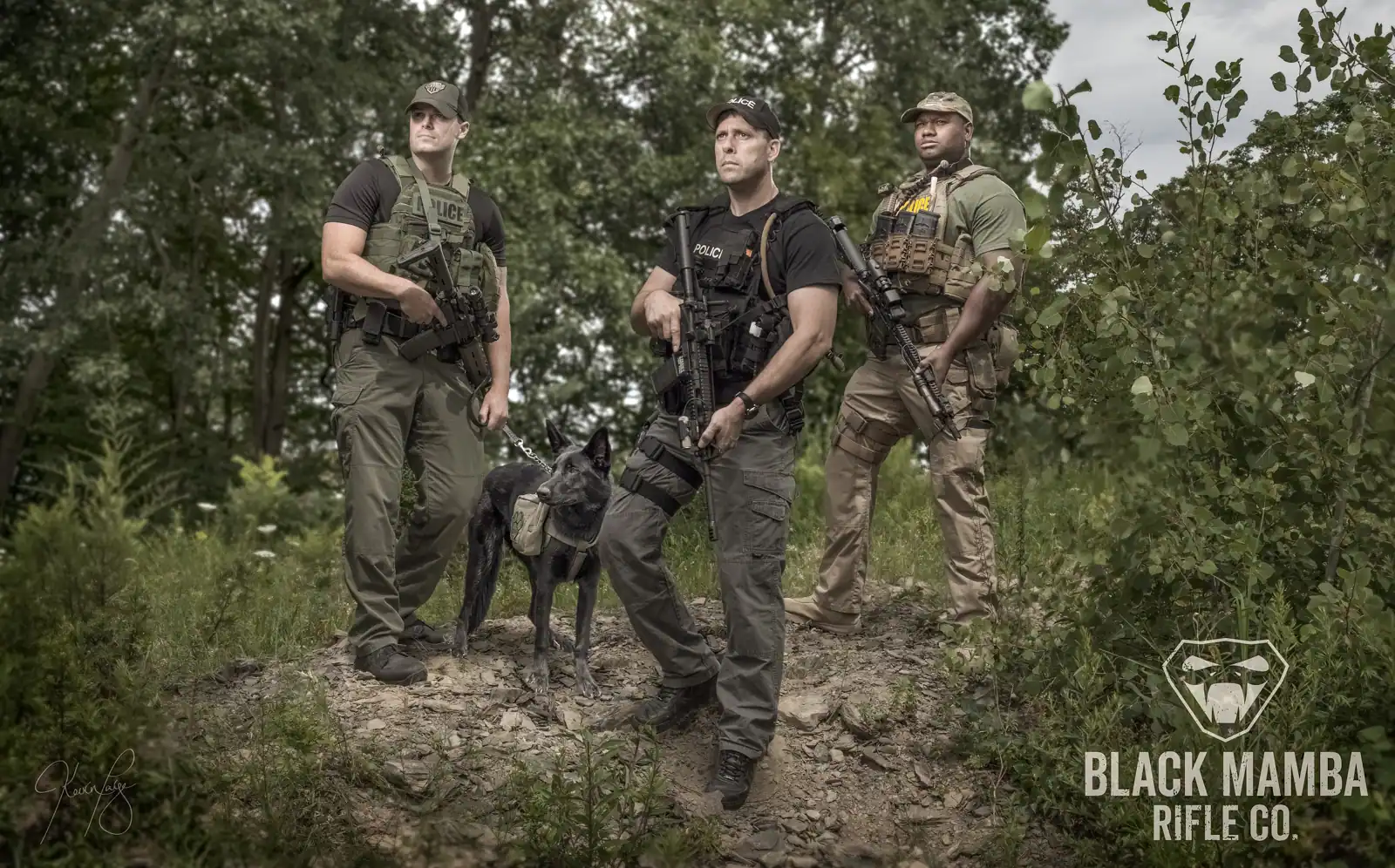 Tactical K9 unit in the field — commercial production still with handlers and working dog