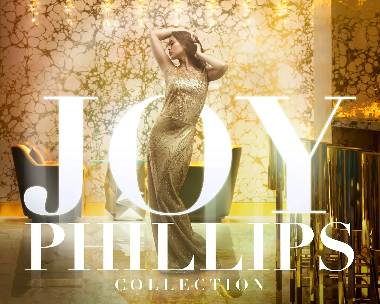 Joy Phillips Collection campaign key art — model in a gold gown against a gilded backdrop